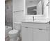 Modern bathroom with a shower-tub combo, toilet and a sink with lighted mirror at 1764 Mondrian Cir, Winter Park, FL 32789