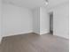 Neutral bedroom with wood flooring, white walls, recessed lighting, and bathroom access at 1764 Mondrian Cir, Winter Park, FL 32789
