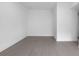Minimalist bedroom with hardwood floors, white walls, and ample natural light at 1764 Mondrian Cir, Winter Park, FL 32789