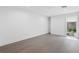 Well lit bedroom with hardwood floors and a window with view to a private patio at 1764 Mondrian Cir, Winter Park, FL 32789