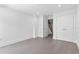 Bright bedroom with hardwood floors, closet and door to hallway with stairway at 1764 Mondrian Cir, Winter Park, FL 32789