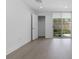Bright bedroom with wood floors and sliding glass doors to a private patio at 1764 Mondrian Cir, Winter Park, FL 32789