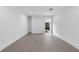 Well lit bedroom with hardwood floors and a window with view to a private patio at 1764 Mondrian Cir, Winter Park, FL 32789
