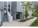 Stylish exterior of a modern condo featuring clean lines, a private entrance, and landscaping at 1764 Mondrian Cir, Winter Park, FL 32789