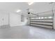 Clean two-car garage with epoxy flooring and freshly painted walls at 1764 Mondrian Cir, Winter Park, FL 32789