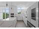 Bright, spacious kitchen with modern appliances, an island, and floor-to-ceiling windows at 1764 Mondrian Cir, Winter Park, FL 32789