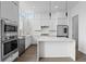 Modern kitchen featuring sleek white cabinetry, stainless steel appliances, and an island at 1764 Mondrian Cir, Winter Park, FL 32789
