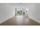 Bright, open-concept living space with hardwood floors and large windows at 1764 Mondrian Cir, Winter Park, FL 32789