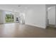 Bright, open-concept living space with hardwood floors and large windows at 1764 Mondrian Cir, Winter Park, FL 32789