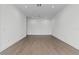 Minimalist living room featuring hardwood floors, neutral walls, recessed lighting and clean trim at 1764 Mondrian Cir, Winter Park, FL 32789