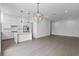 Open concept living space with modern kitchen, island, and hardwood flooring at 1764 Mondrian Cir, Winter Park, FL 32789
