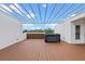Enjoy this rooftop deck with a hot tub and a covered pergola, offering a private retreat with stunning views at 1764 Mondrian Cir, Winter Park, FL 32789