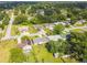 Neighborhood aerial showcasing verdant landscaping, well-spaced houses, and mature trees at 206 Montana Ave, St Cloud, FL 34769