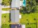 Aerial view of a property with a well-maintained lawn and a private backyard pool at 206 Montana Ave, St Cloud, FL 34769