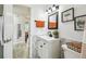 Stylish bathroom featuring a modern vanity, decorative mirror, and updated fixtures at 206 Montana Ave, St Cloud, FL 34769