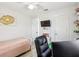 Cozy bedroom featuring a twin bed, desk area, and modern decor at 206 Montana Ave, St Cloud, FL 34769