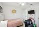 Cozy bedroom featuring a twin bed, desk area, and modern decor at 206 Montana Ave, St Cloud, FL 34769