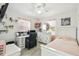 A clean and organized bedroom with a bed, desk, and dresser at 206 Montana Ave, St Cloud, FL 34769
