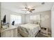Bedroom features a bed, wood furniture, neutral colors, and plenty of natural light at 206 Montana Ave, St Cloud, FL 34769
