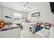 Bright bedroom features two twin beds, playful decor, and large windows for ample natural light at 206 Montana Ave, St Cloud, FL 34769
