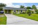 Inviting single-story home with tidy landscaping, shutters, and a well-kept lawn, showing pride of ownership at 206 Montana Ave, St Cloud, FL 34769