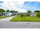 Street view of a home with a lush lawn and a tidy yard in a tranquil residential setting at 206 Montana Ave, St Cloud, FL 34769