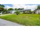 Quaint single-story home with a large front yard, mature landscaping and a welcoming neighborhood ambiance at 206 Montana Ave, St Cloud, FL 34769