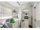 Laundry area with washer, dryer and storage solutions, conveniently located near the kitchen at 206 Montana Ave, St Cloud, FL 34769