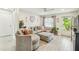 Bright living room with a comfortable sectional sofa, stylish decor, and natural light at 206 Montana Ave, St Cloud, FL 34769