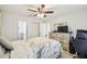 Bright main bedroom with ceiling fan, closet, wood-look flooring, and neutral color palette at 206 Montana Ave, St Cloud, FL 34769
