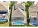 Aerial view of the home's backyard featuring a large pool with screened enclosure at 2624 Daulby St, Kissimmee, FL 34747