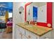 Bathroom featuring granite countertops, white cabinetry, and cartoon themed decor at 2624 Daulby St, Kissimmee, FL 34747
