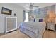Charming bedroom with a wish on the wall, large bed, decorative pillows, curtains, and large dresser at 2624 Daulby St, Kissimmee, FL 34747