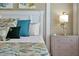 Cozy bedroom featuring coastal decor, a flamingo lamp, and a calming ambiance, perfect for relaxing after a long day at 2624 Daulby St, Kissimmee, FL 34747
