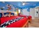 Charming themed bedroom with custom murals, two twin beds, and playful decor, a delightful space for children at 2624 Daulby St, Kissimmee, FL 34747
