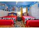 Fun bedroom with colorful Toy Story themed decor, twin beds, and playful accents perfect for to play and sleep at 2624 Daulby St, Kissimmee, FL 34747