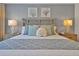 Beautifully decorated bedroom featuring light blue walls and beach-themed decor at 2624 Daulby St, Kissimmee, FL 34747