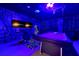 Finished basement offers a modern game room with pool table, arcade game, and TV at 2624 Daulby St, Kissimmee, FL 34747