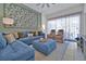 Comfortable living room features a sectional sofa, plush seating, and stylish decor at 2624 Daulby St, Kissimmee, FL 34747