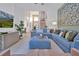 Open living space with large sofa, decorative art, and easy access to dining and stairway at 2624 Daulby St, Kissimmee, FL 34747