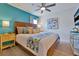 Comfortable main bedroom with wood accents, stylish bedside tables, and soft lighting at 2624 Daulby St, Kissimmee, FL 34747