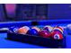 Close-up of the pool table balls in the modern finished basement game room at 2624 Daulby St, Kissimmee, FL 34747