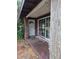 Entrance of a modest home featuring a covered porch and single door entrance at 2638 S Laurel Ave, Sanford, FL 32773