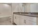 Bathroom featuring double sink vanity with gray countertop and tiled floor at 2932 Muller Oak Loop, Ocoee, FL 34761