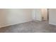 Bedroom with neutral color, soft carpet and a doorway at 2932 Muller Oak Loop, Ocoee, FL 34761