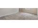 Bedroom with neutral walls and gray carpet at 2932 Muller Oak Loop, Ocoee, FL 34761