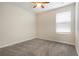 Bedroom showcasing a ceiling fan, a window and soft carpeting at 2932 Muller Oak Loop, Ocoee, FL 34761
