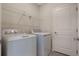 Laundry room with appliances and wire shelving at 2932 Muller Oak Loop, Ocoee, FL 34761