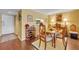 Dining area with hardwood floors and a view of the kitchen with bright paint color at 300 Carolina Ave # 304, Winter Park, FL 32789
