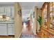 Hallway with hardwood floors leading to the living room, adjacent to the kitchen at 300 Carolina Ave # 304, Winter Park, FL 32789